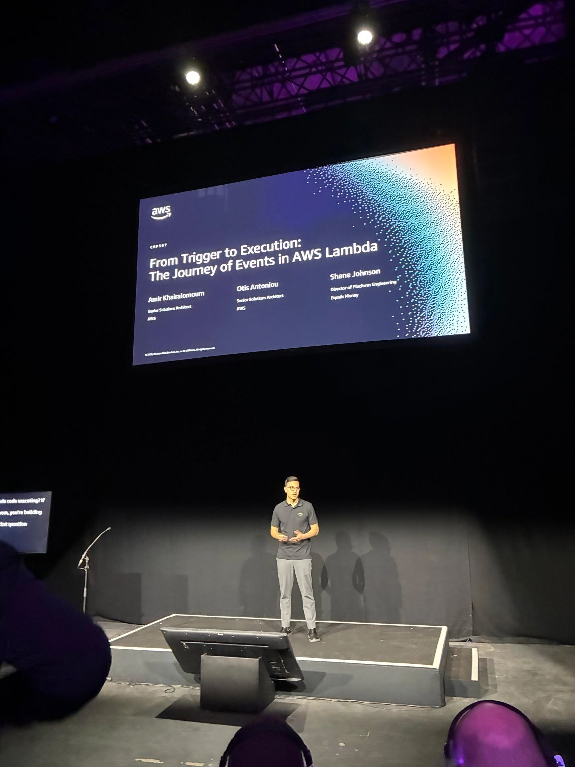 Otis Antoniou presenting From Trigger to Execution at AWS Summit London.
