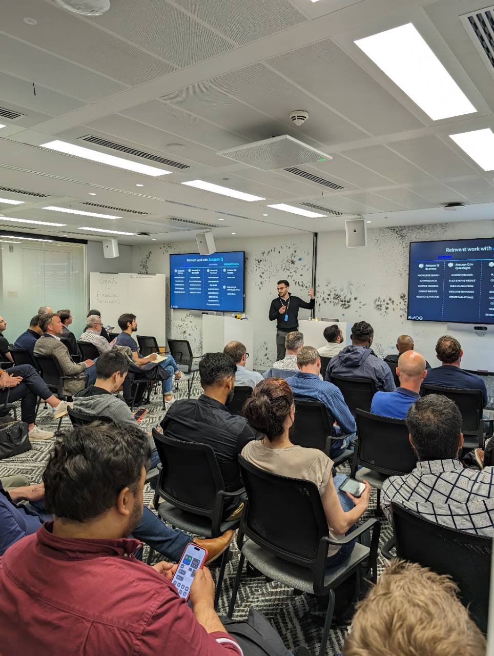 Otis Antoniou presenting Generative AI in Financial Services to an audience at AWS London.